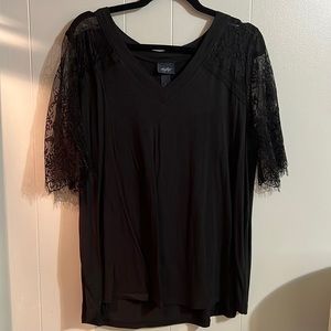 Black top with sheer fringed sleeves